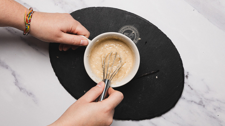 Whisking mix in mug cake