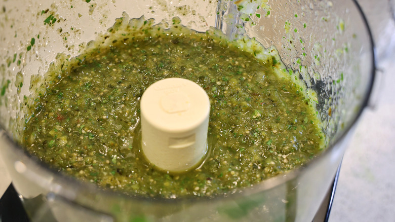 food processor filled with salsa verde