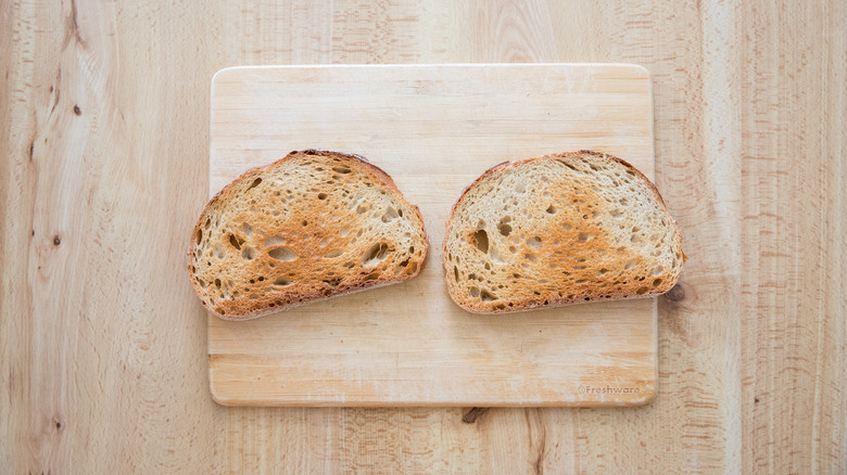 toasted bread on wooden board