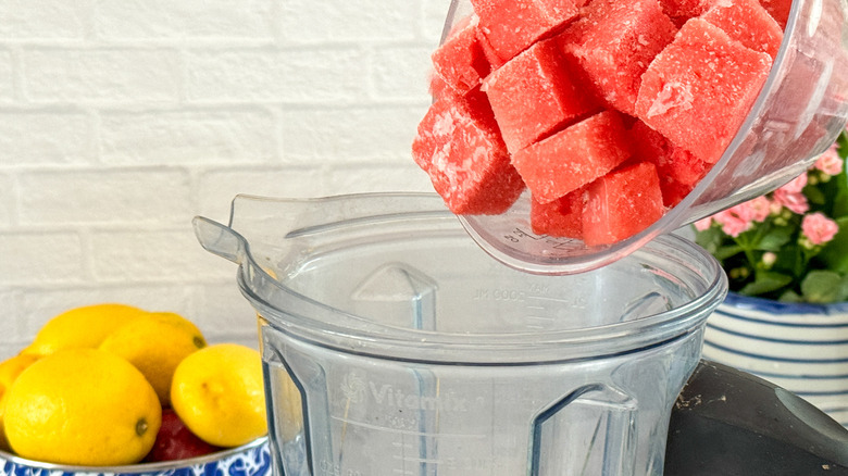 adding watermelon to blender