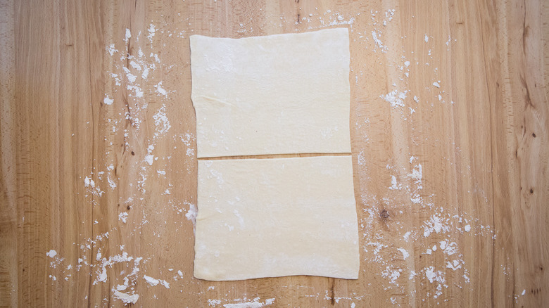 Puff pastry on wooden table