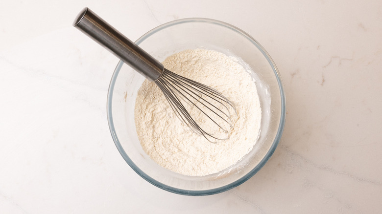 flour in bowl with whisk