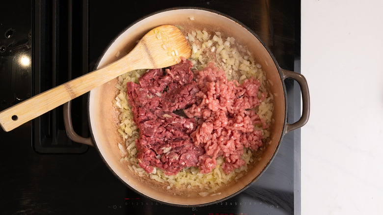 ground meat added to pan
