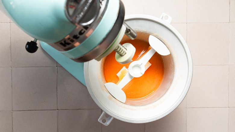 Liquid cantaloupe sorbet in ice cream machine