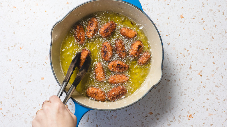 Frying Sweet potato tater tots in pan