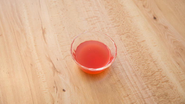 pink simple syrup in dish