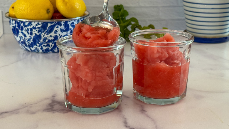 spoon filling up glass