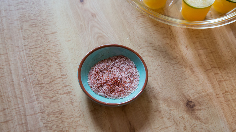 margarita salt mixture in dish next to plate of popsicles