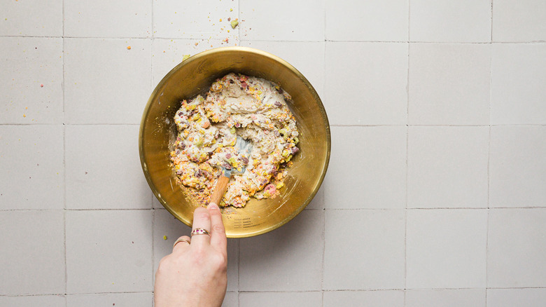 Mixing ice cream with cereal in bowl