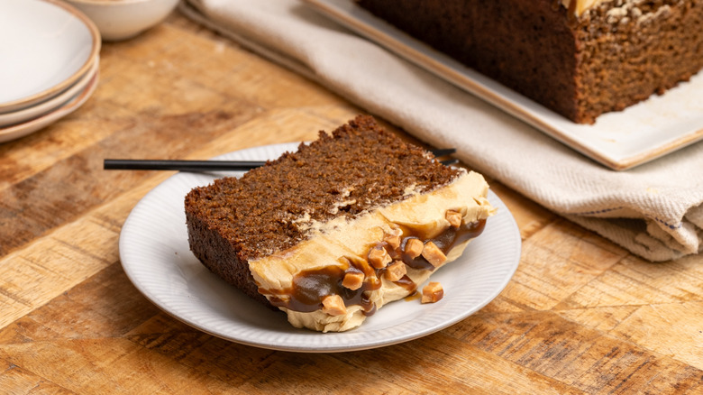 sticky toffee pudding loaf cake slice on plate