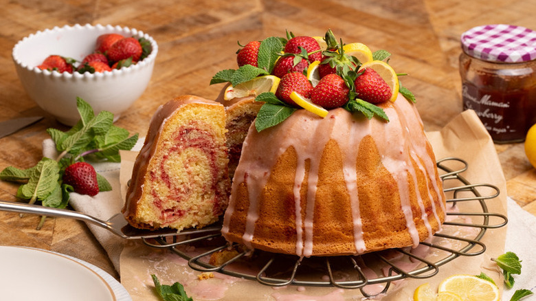 Lemon and strawberry bundt cake with slice pulled out
