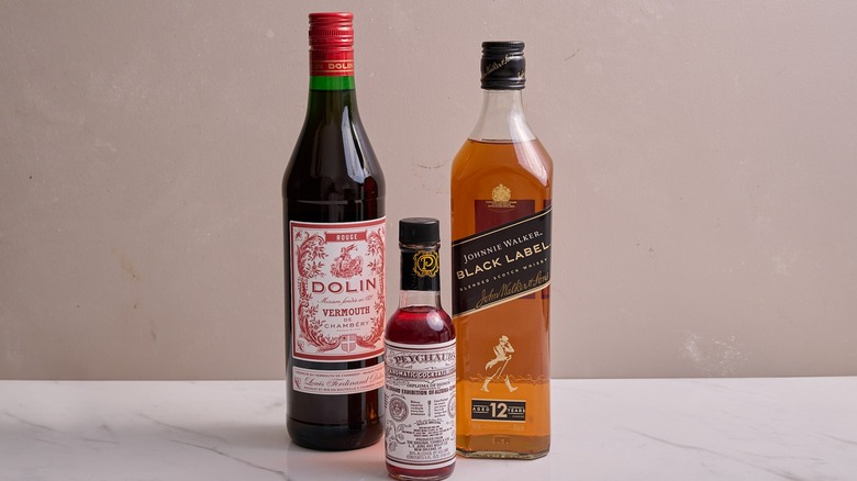 scotch, vermouth, and bitters on a table