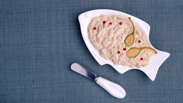 Fish pate with capers in a ceramic fish-shaped dish