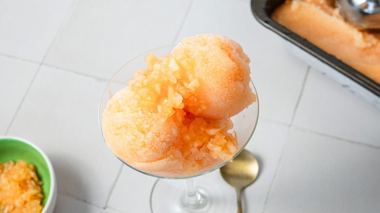 An overhead view of a glass of cantaloupe sorbet