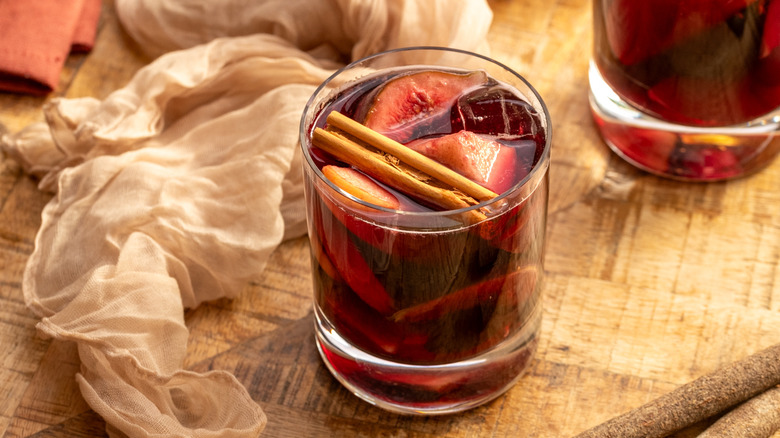 Red sangria in glass with cinnamon stick