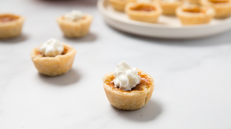 mini pumpkin pies on table